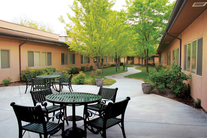 exterior seating area with table at Monument Health South Salt Lake