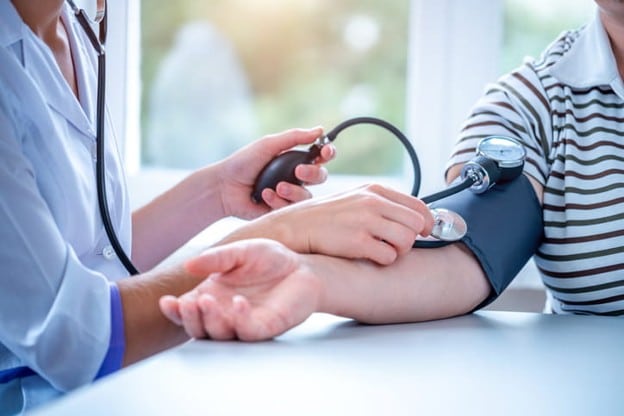 What Causes Low Blood Pressure In The Elderly? 2 A nurse takes a woman's blood pressure.